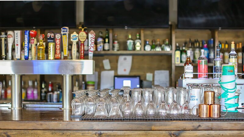 Bar with pint glasses and beer taps